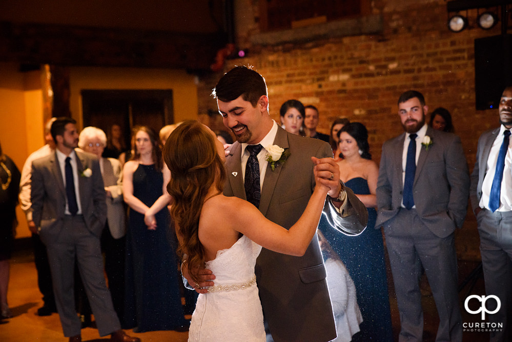 Bride and groom first dance at their wedding reception.