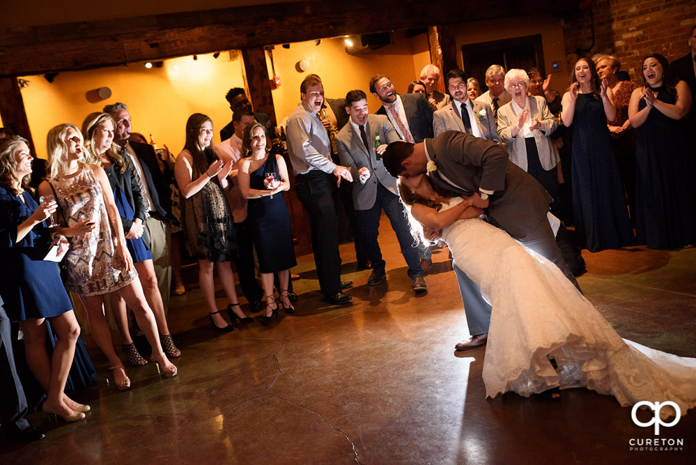 Bride and groom first dance at their wedding reception.