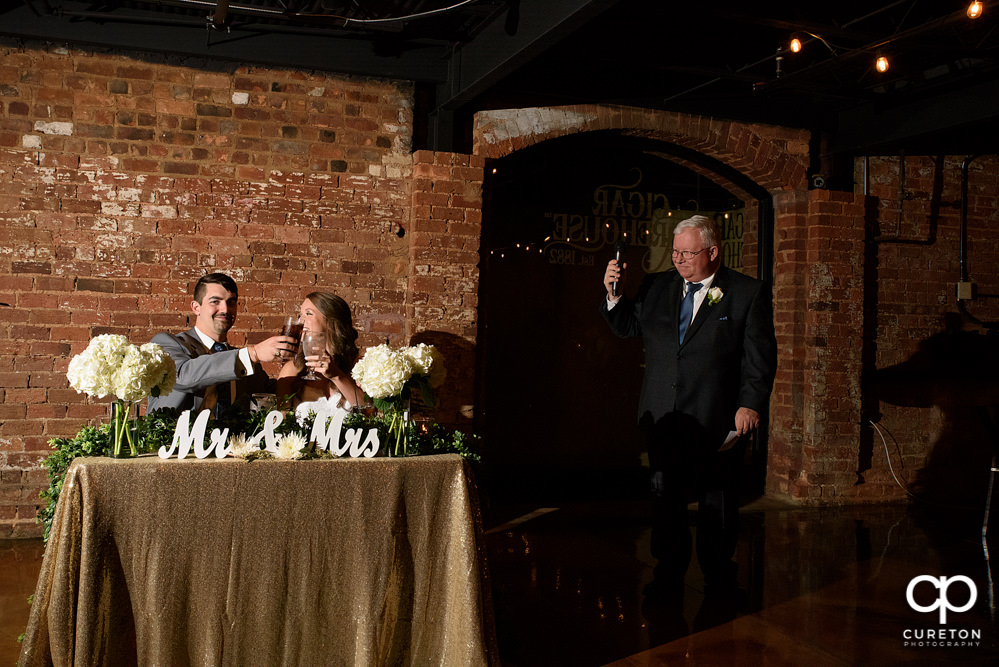 Bride's father giving a toast.