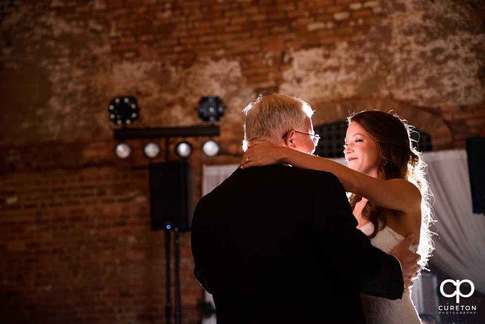 Bride and father dance.