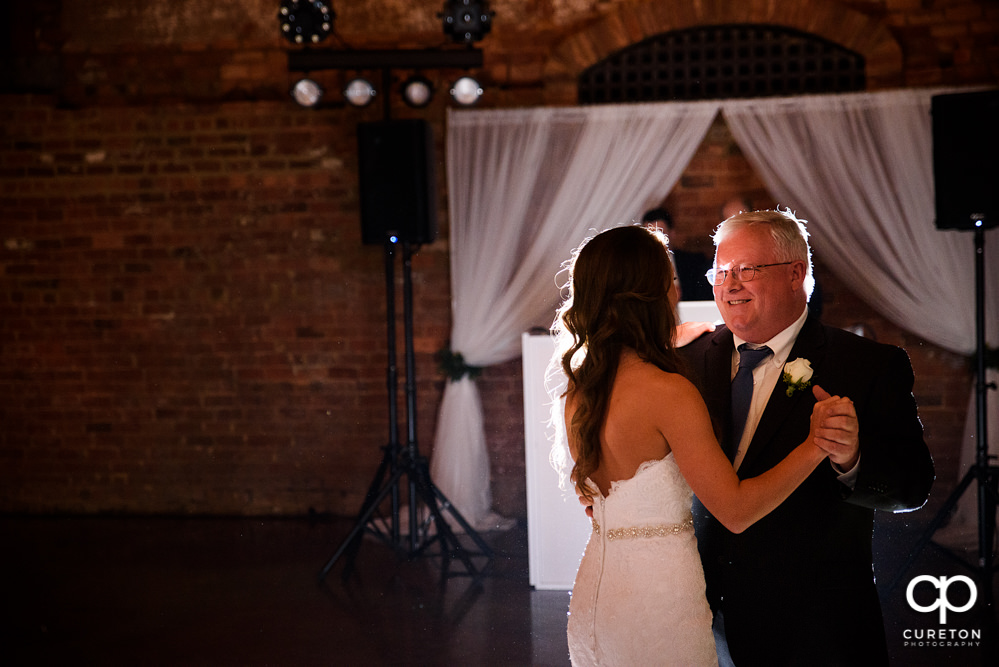 Bride and father dance.
