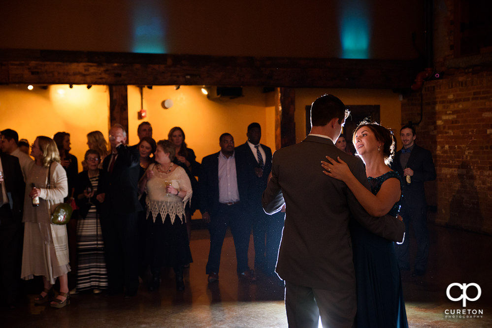 Groom and mother dance.