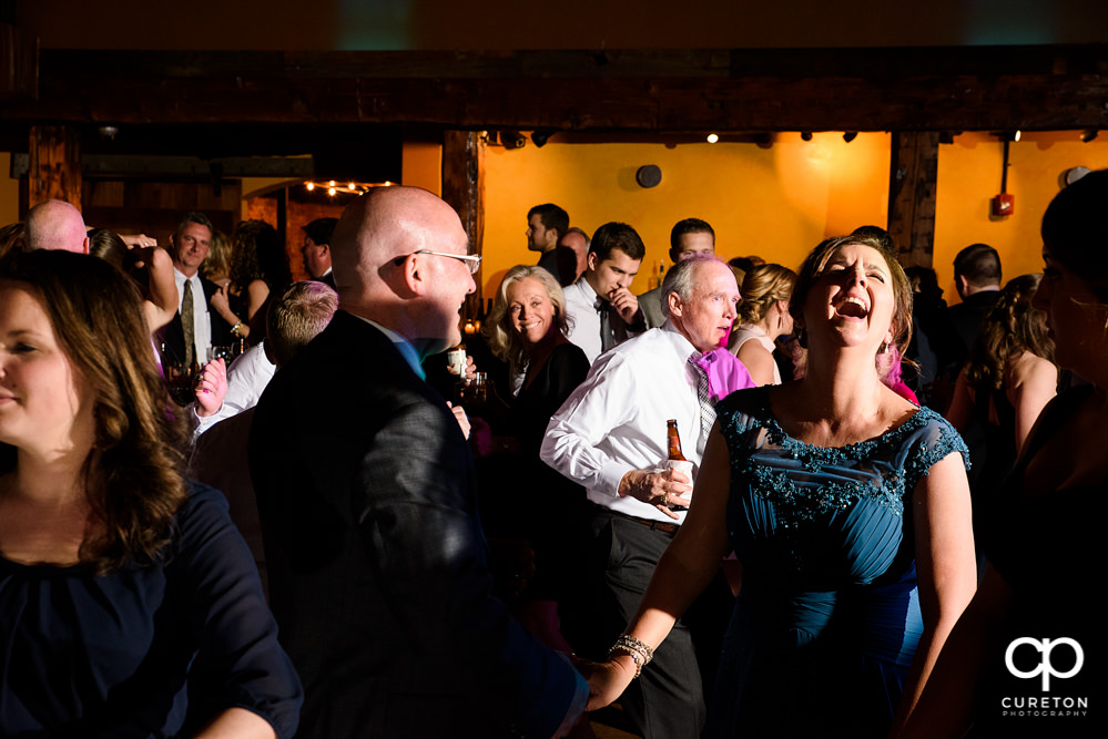 Guests dancing at the wedding reception to the sounds of Uptown Entertainment.