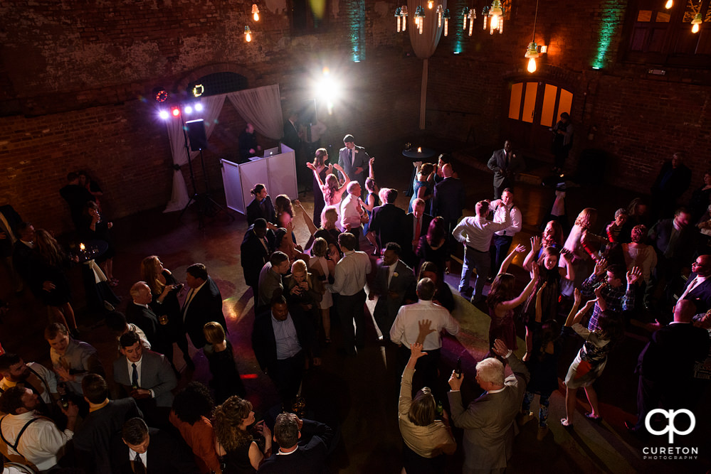 Guests dancing at the wedding reception to the sounds of Uptown Entertainment.