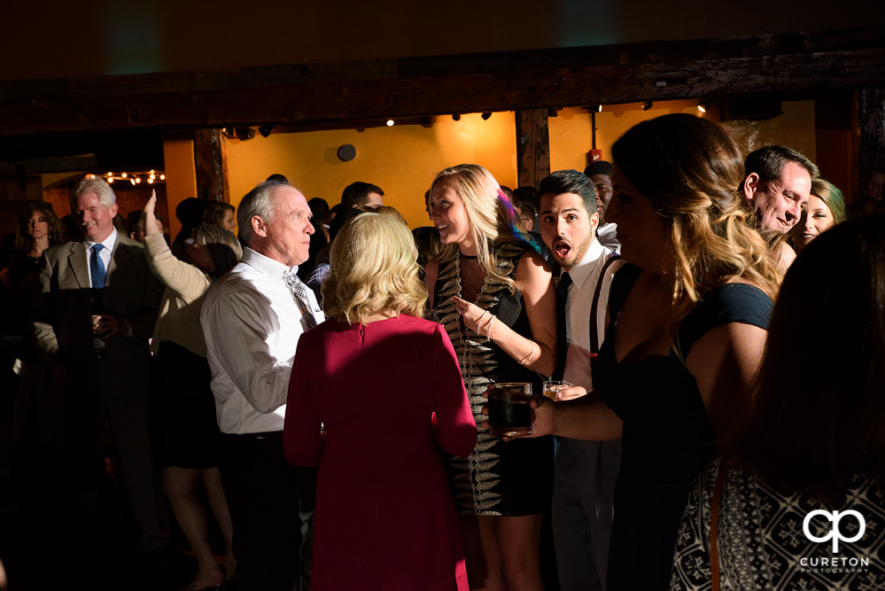 Guests dancing at the wedding reception to the sounds of Uptown Entertainment.