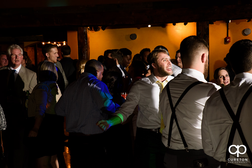 Guests dancing at the wedding reception to the sounds of Uptown Entertainment.