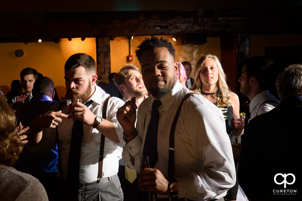 Guests dancing at the wedding reception to the sounds of Uptown Entertainment.