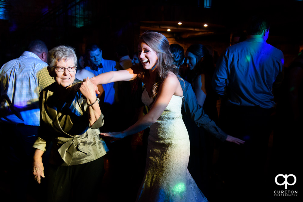 Guests dancing at the wedding reception to the sounds of Uptown Entertainment.