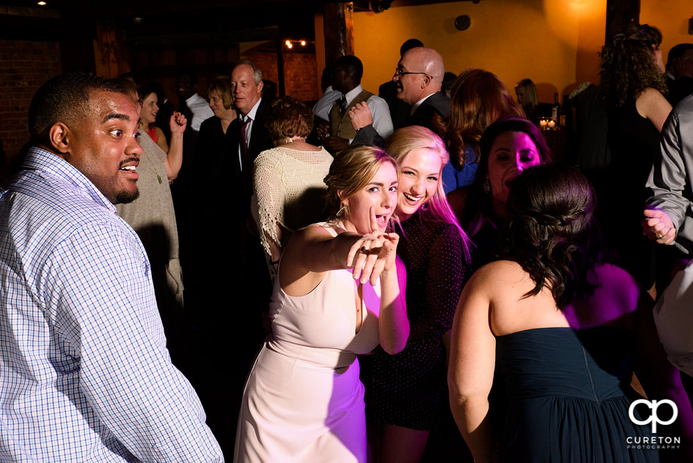 Guests dancing at the wedding reception to the sounds of Uptown Entertainment.