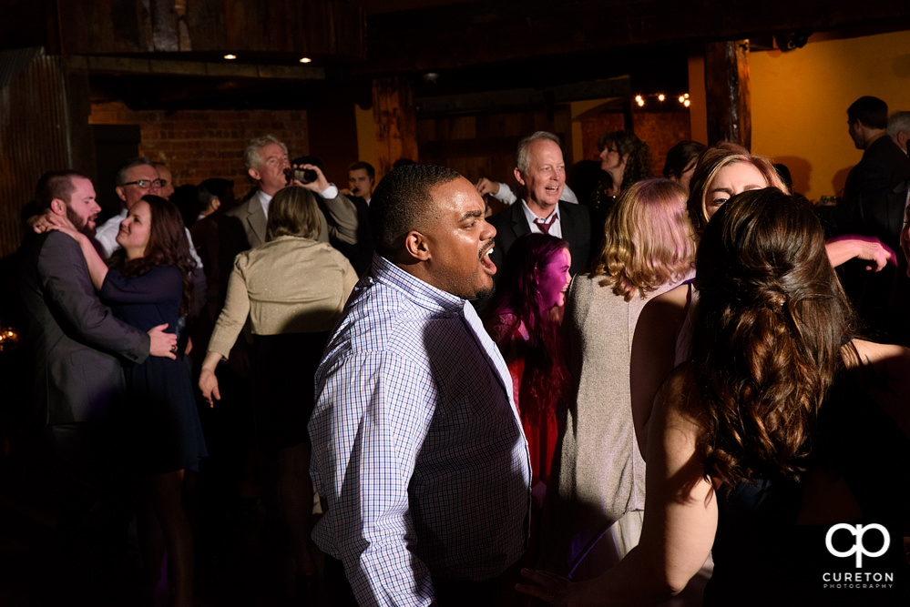 Guests dancing at the wedding reception to the sounds of Uptown Entertainment.