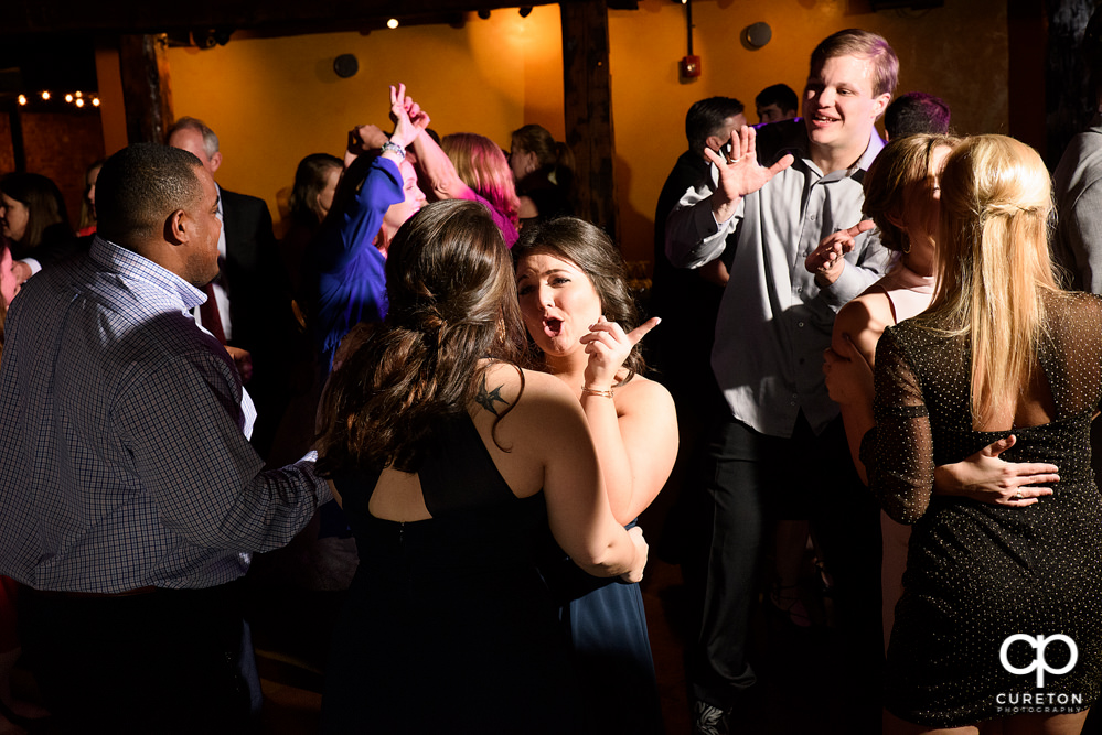 Guests dancing at the wedding reception to the sounds of Uptown Entertainment.