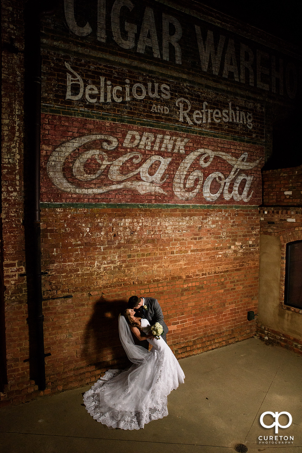 Bride and groom night portrait at Old Cigar Warehouse.