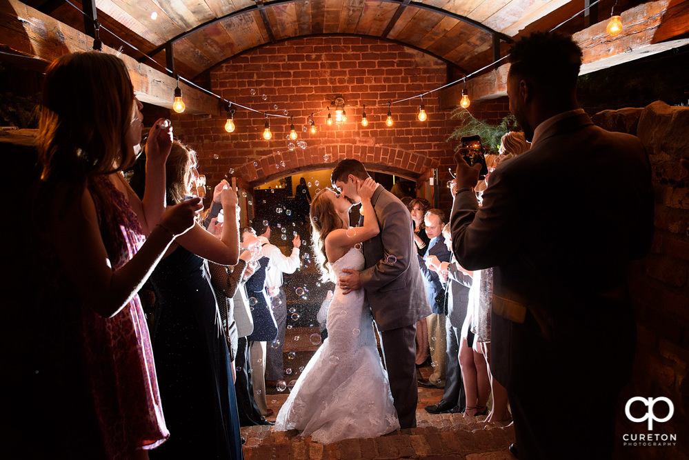 Bride and groom bubble leave at The Old Cigar Warehouse wedding.