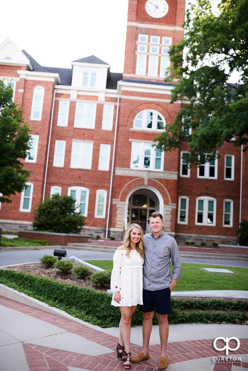 Engaged couple standing in front of Tillman Hall in Clemson,SC.