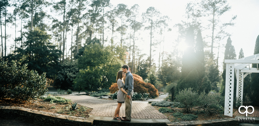 Pano of a couple during an engagement session at the Botanical Gardens in Clemson.