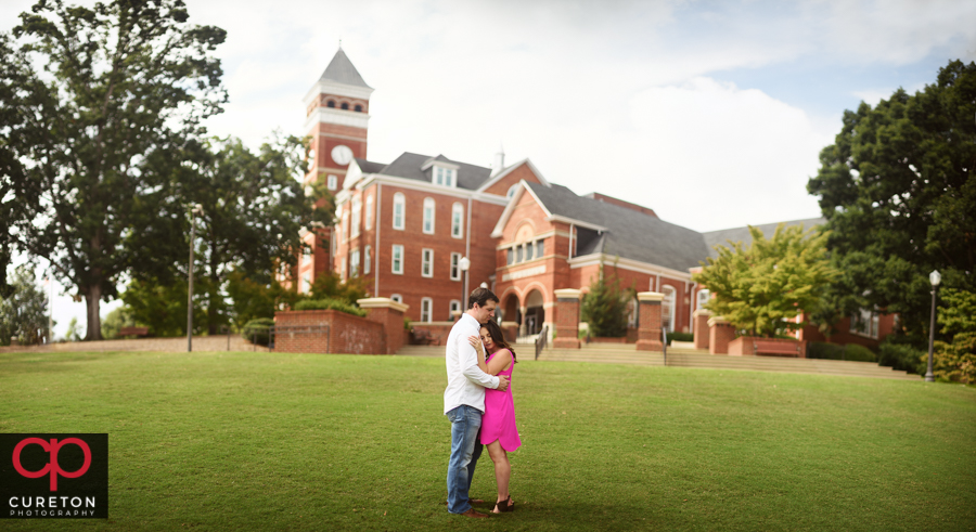 Engaged couple on Bowman field during their Clemson University engagement session.