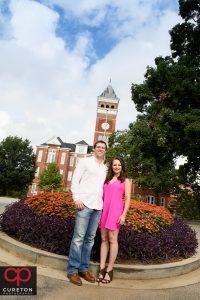 Future bride and groom standing in front of tillman Hall.