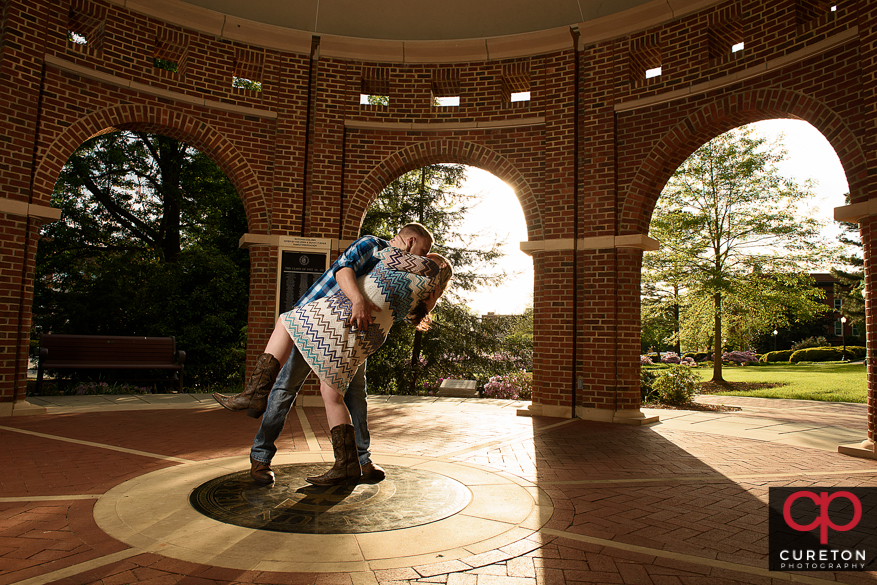 Engaged couple in amazing sunlight during a Clemson engagement session.