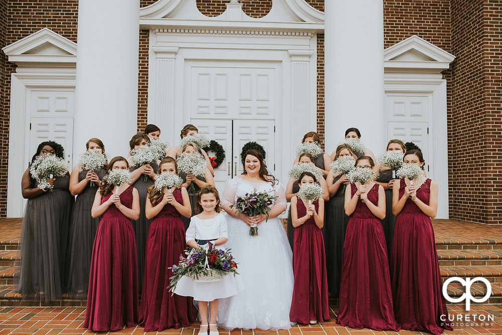 Bride and bridesmaids on the steps of the church before the Spartanburg wedding.