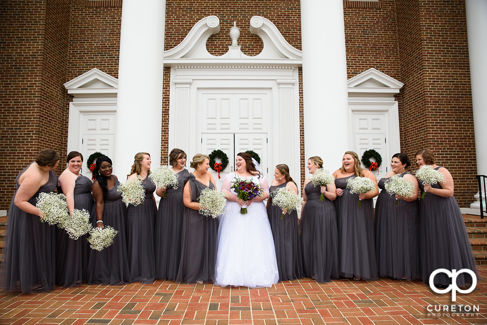 Bride and bridesmaids laughing before the Spartanburg wedding.