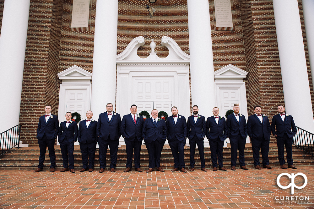 Groomsmen lining up outside the church.