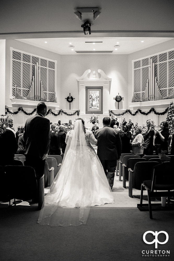 Bride and her father walking down the aisle.