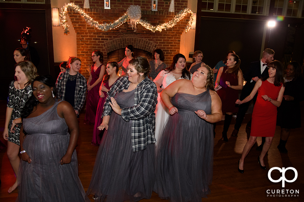 Wedding guests dancing to Uptown Entertainment.