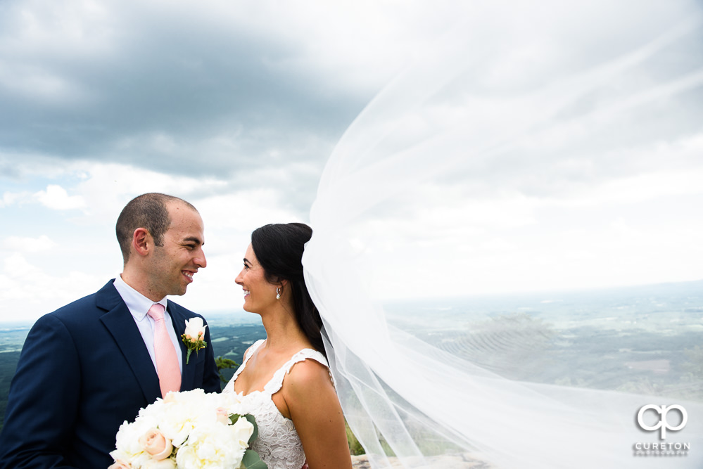 Bride and Groom looking into each others eyes at the overlook after their Cliffs at Glassy Chapel wedding.