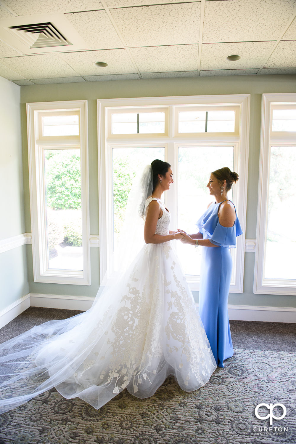Bride and her mother getting ready at the Cliffs at Glassy clubhouse.
