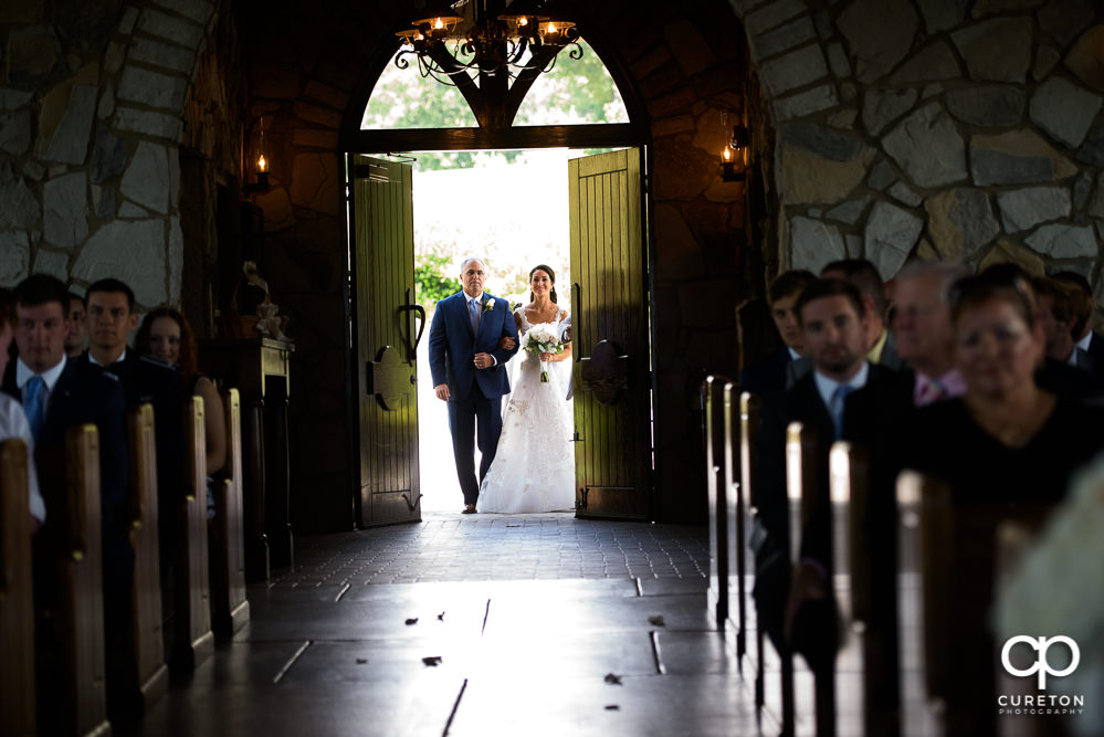 Bride and father as the doors open at Glassy chapel before she walks down the aisle at her wedding.