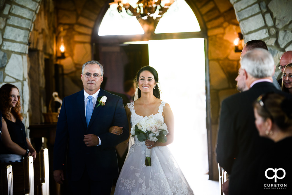 Bride and her father walking down the aisle at Glassy Chapel.