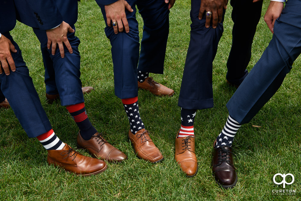 Groomsmen wearing patriotic socks.