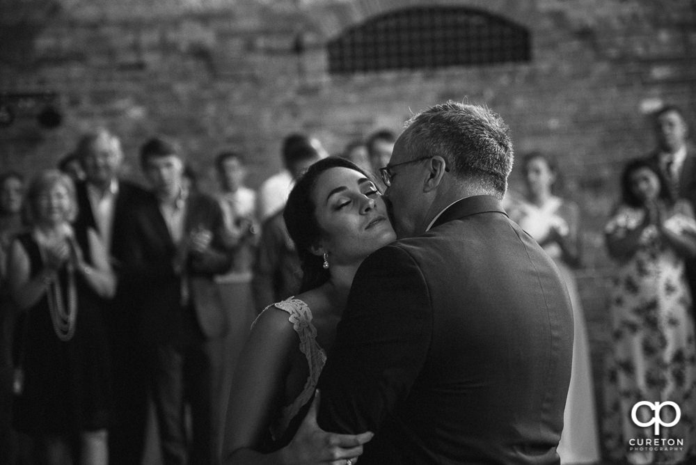 Bride and father dance at the wedding reception.