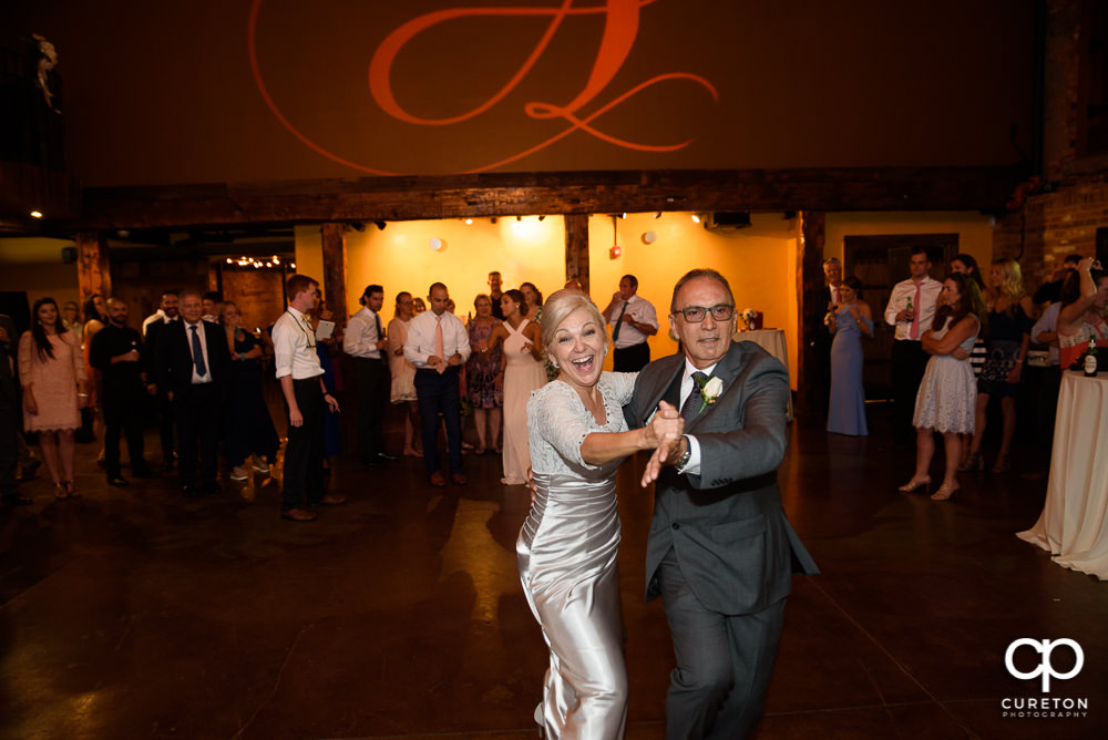Wedding guests dance at the Old Cigar Warehouse reception.
