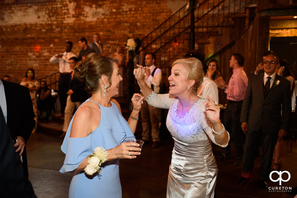 Wedding guests dance at the Old Cigar Warehouse reception.