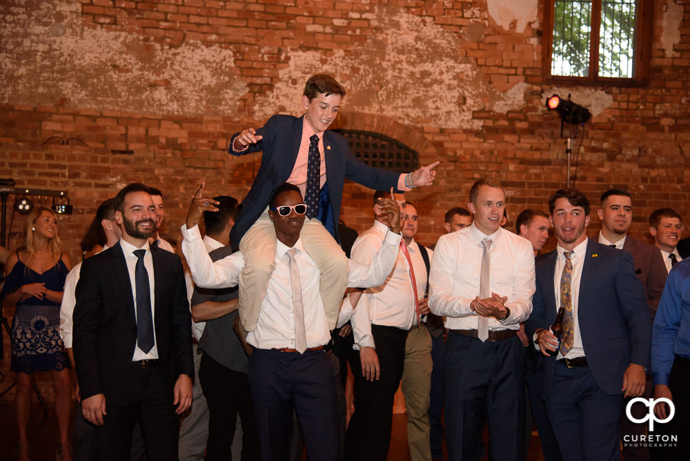 Groom gets iced during the garter removal.