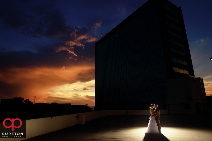 Bride and Groom at sunset on the roof near the Commerce Club n Greenville,SC.