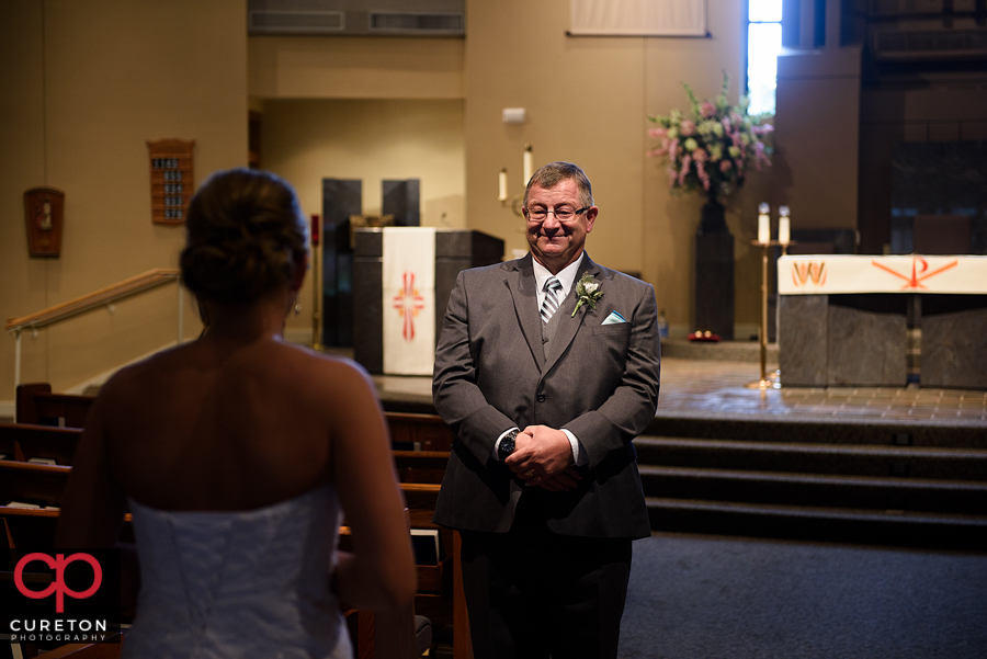 Dad sees his daughter on her wedding day for the first time.