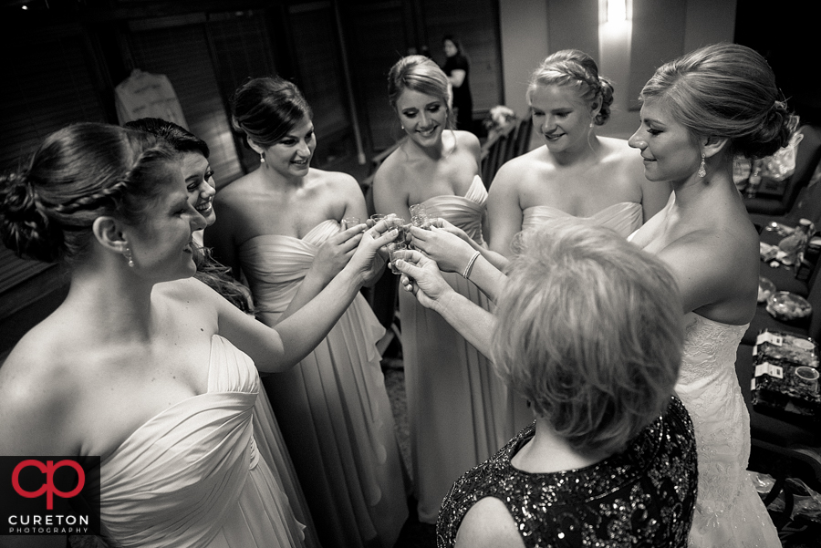 Bridesmaids having a shot before the wedding.