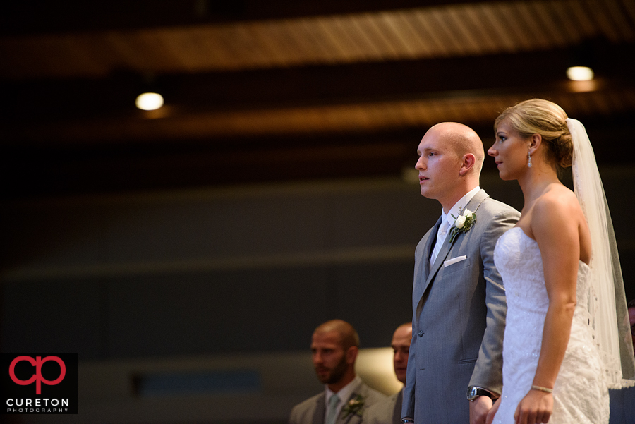 Bride and groom during the ceremony at St. Mary's church in Greenville,SC.