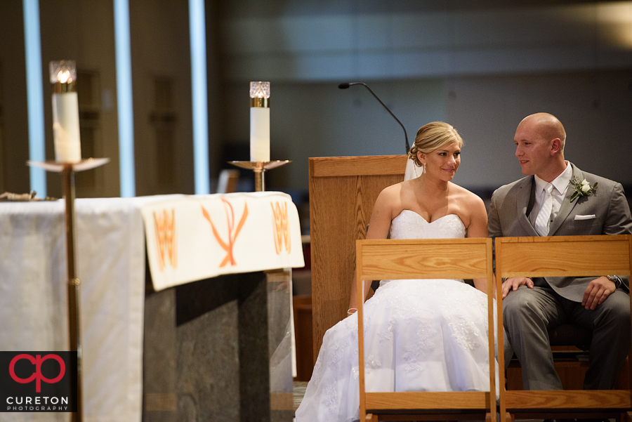 Bride and groom during the ceremony at St. Mary's church in Greenville,SC.