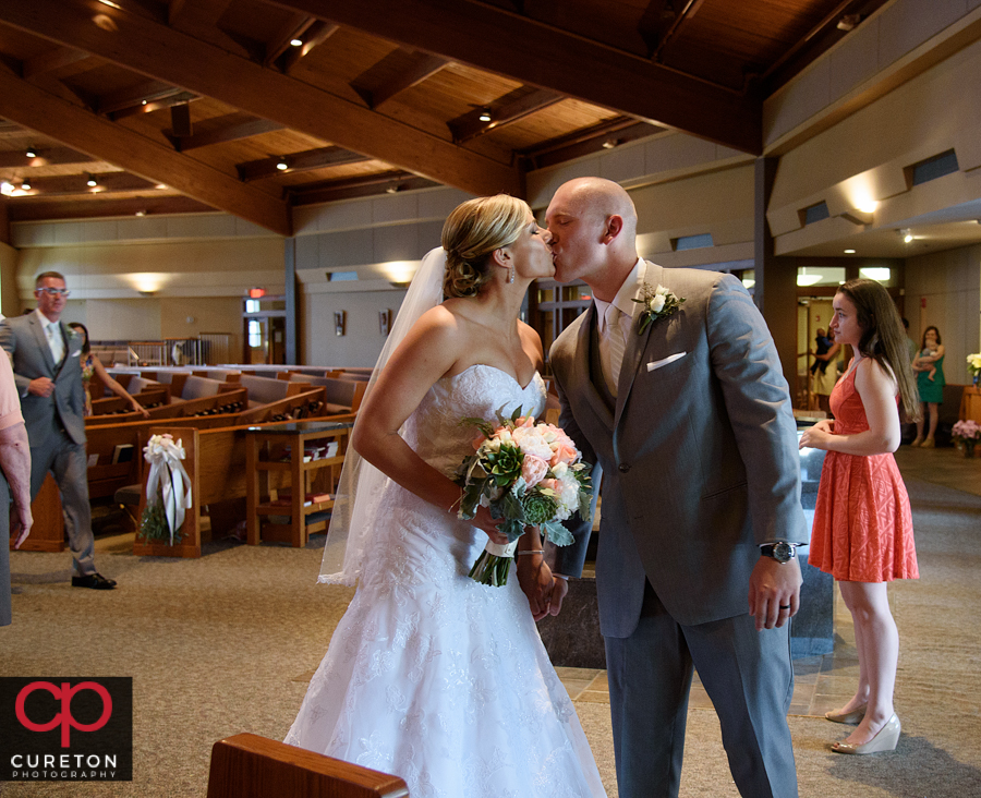 Bride and groom during the ceremony at St. Mary's church in Greenville,SC.