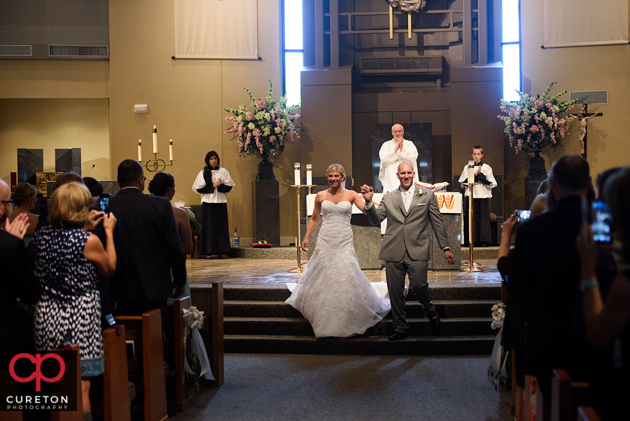 Bride and groom during the ceremony at St. Mary's church in Greenville,SC.