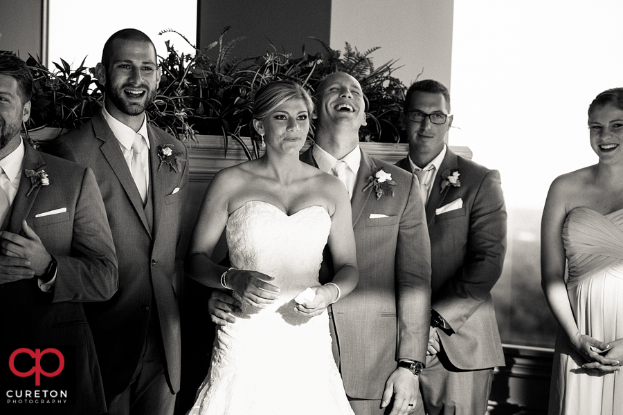 Bride listens to a toast.