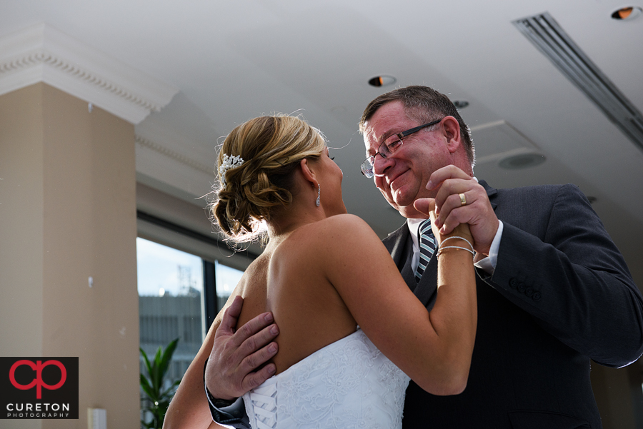 Bride and father dance.