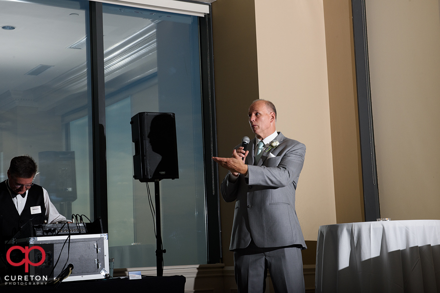 Groom's father gives a speech.