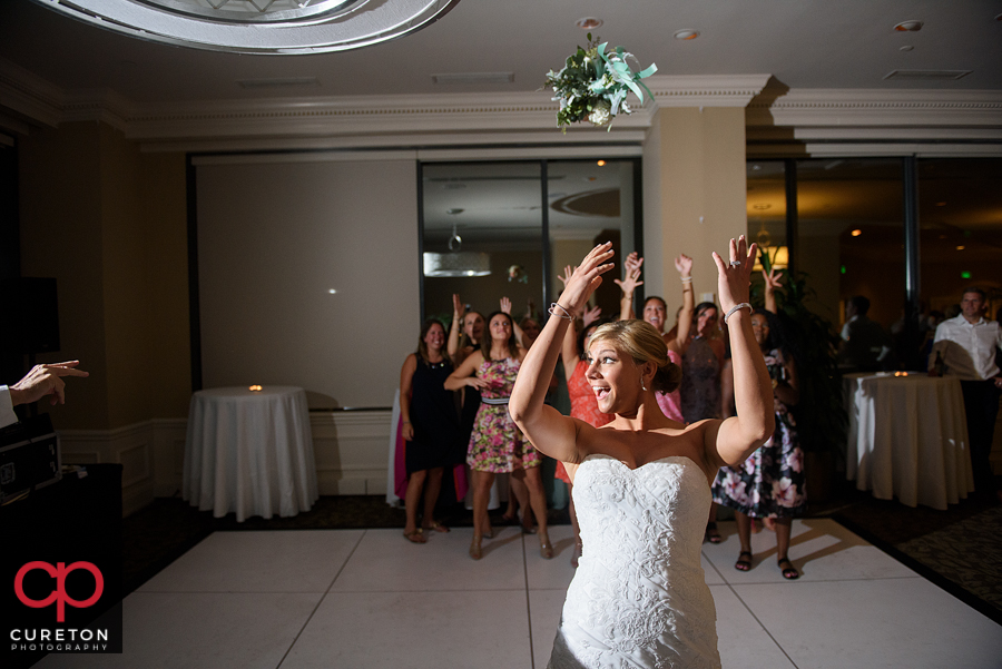 Bride tossing the bouquet. 