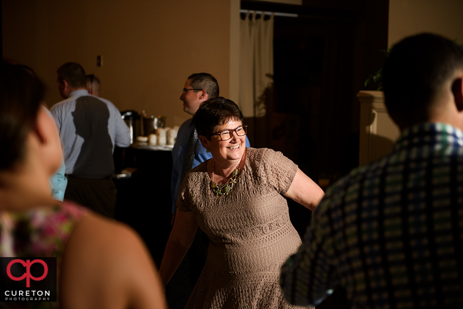 Guests dancing to the sounds of Pros Only DJ at the wedding reception.