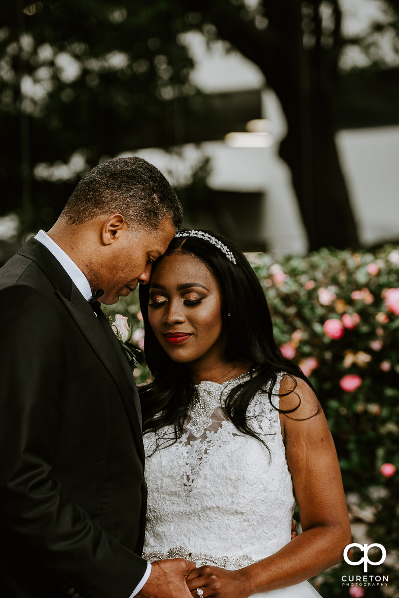 Bride and groom snuggling after the wedding ceremony at the Commerce Club.