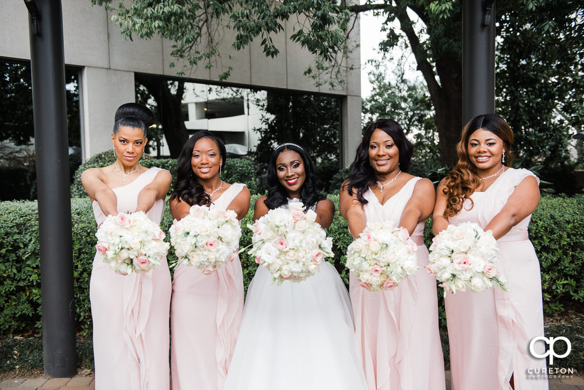 Bride and bridesmaids before the spring wedding at the Commerce Club.